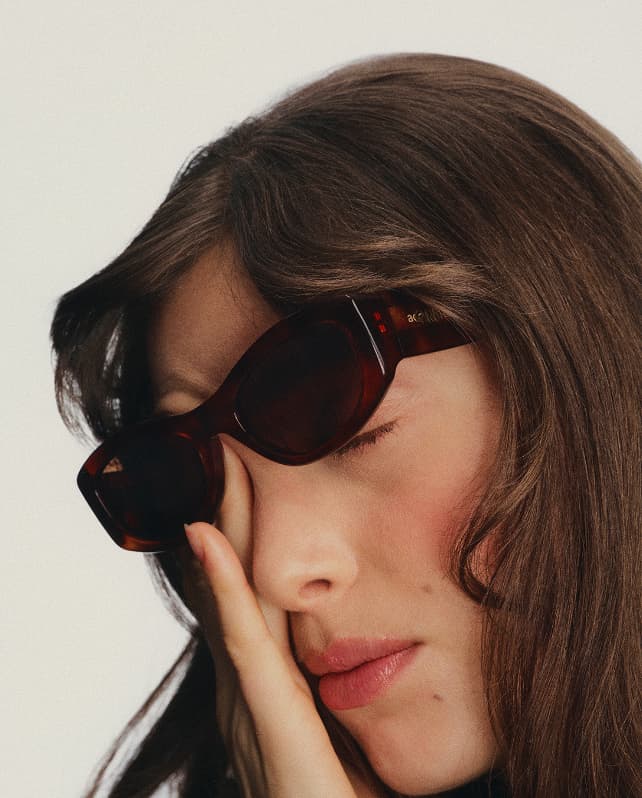 Model scratching her eye 