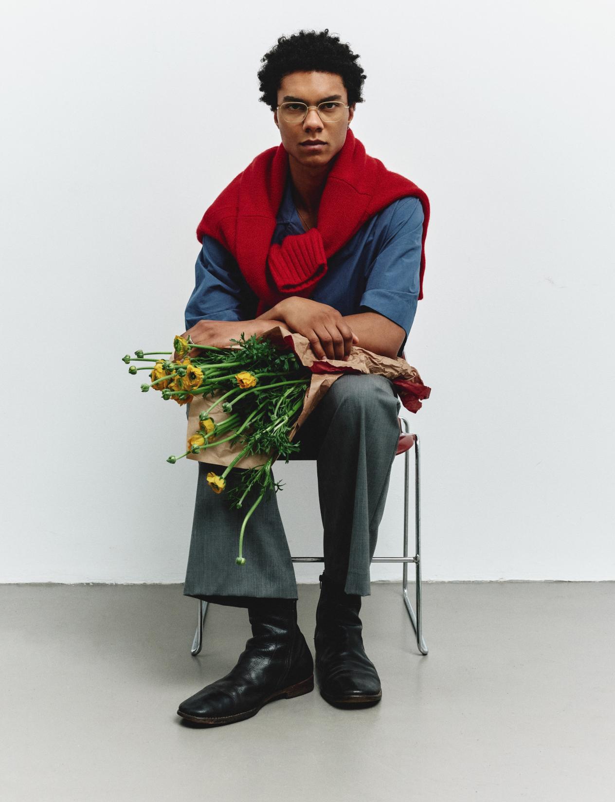 white background male sitting down