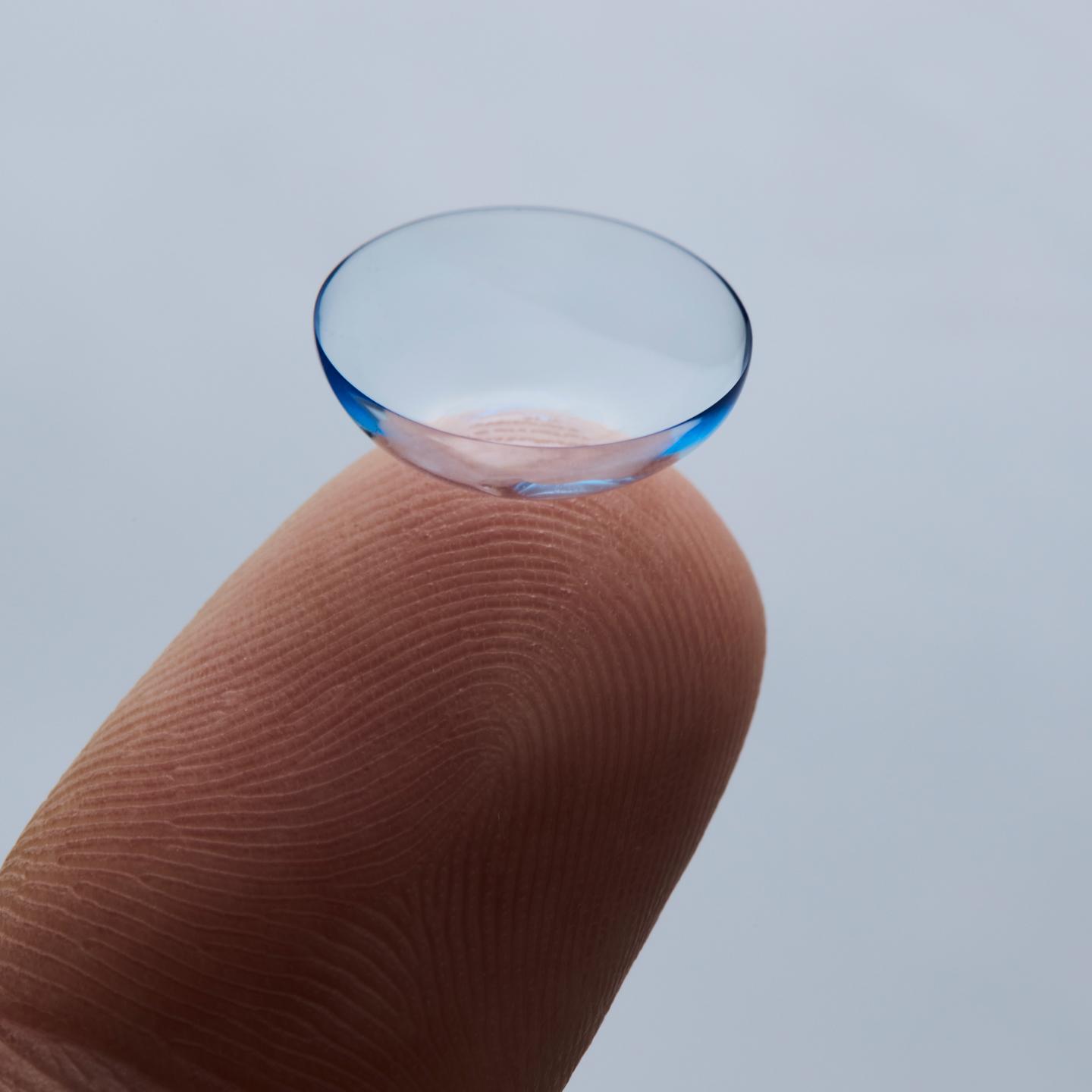 contact lens on a finger desk