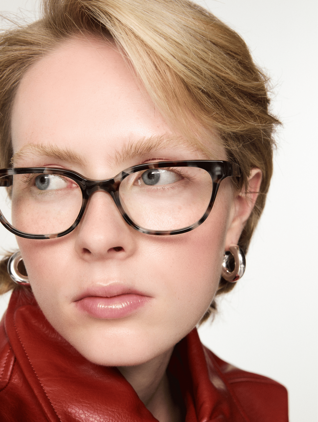 Model wearing opticals - cleo in volcano colour